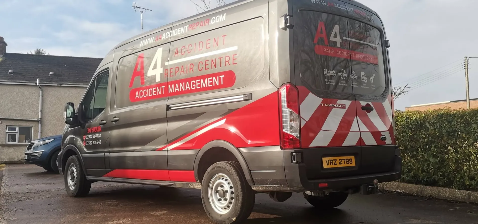 A4 Accident Repair Centre transit van finished in a grey, red and chevron vinyl wrap.