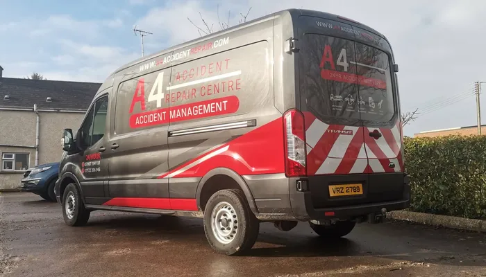 A4 Accident Repair Centre transit van finished in a grey, red and chevron vinyl wrap.