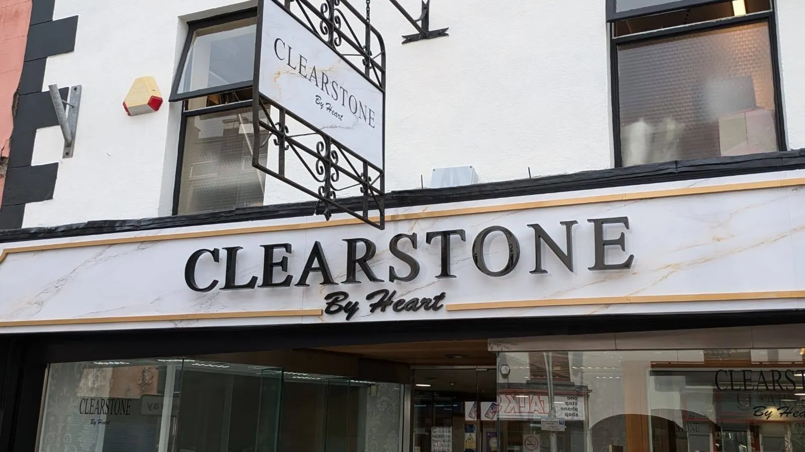 Clearstone by Heart jewellery shop front with a wrought-iron hanging sign and marble-effect fascia lettering.