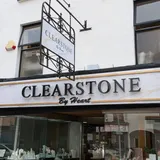 Clearstone by Heart jewellery shop front with a wrought-iron hanging sign and marble-effect fascia lettering.