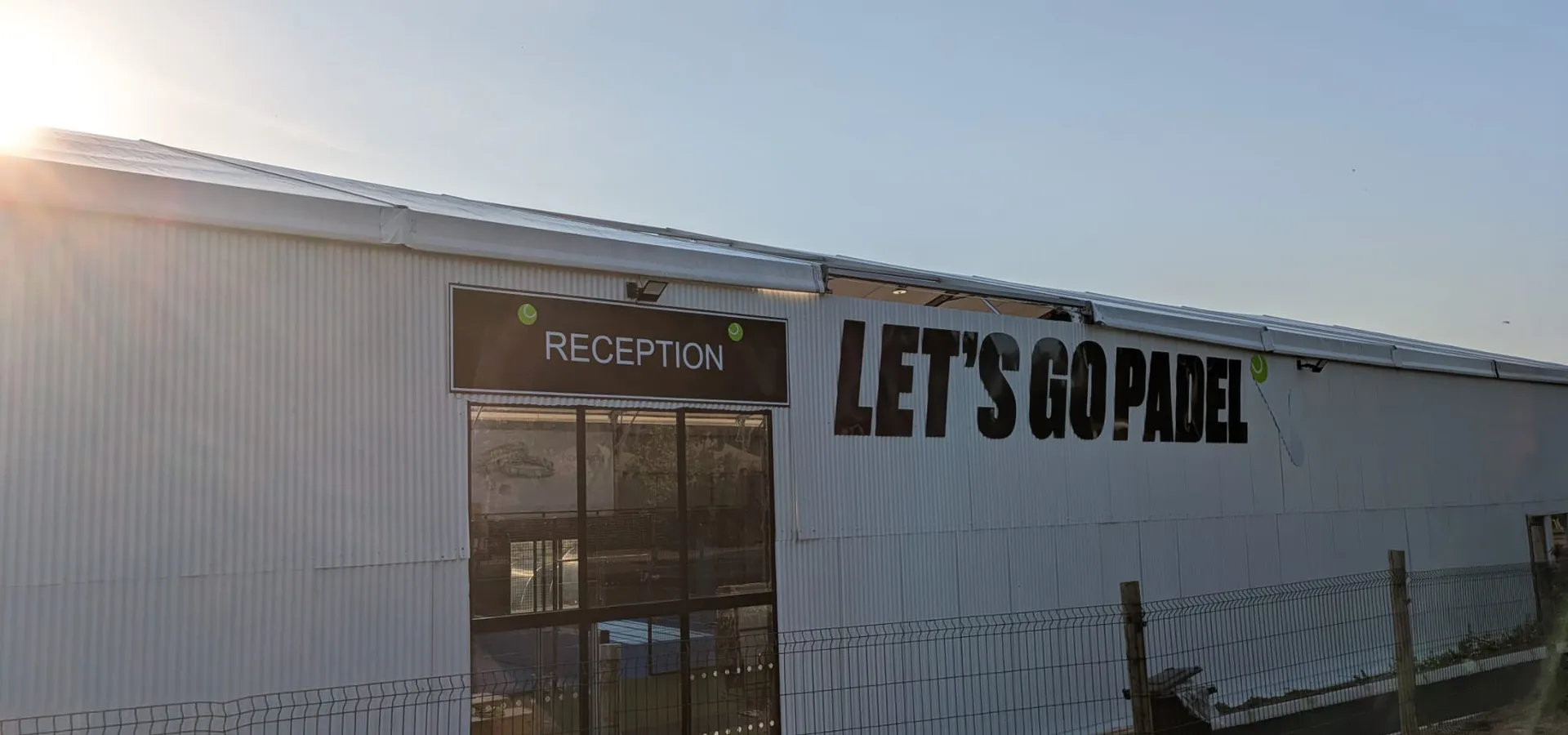 Let's Go Padel building signage and reception sign at the entrance to one of the new venues.