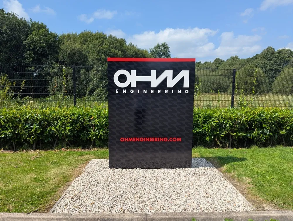 OHM Engineering freestanding illuminated totem sign at the entrance to their site.