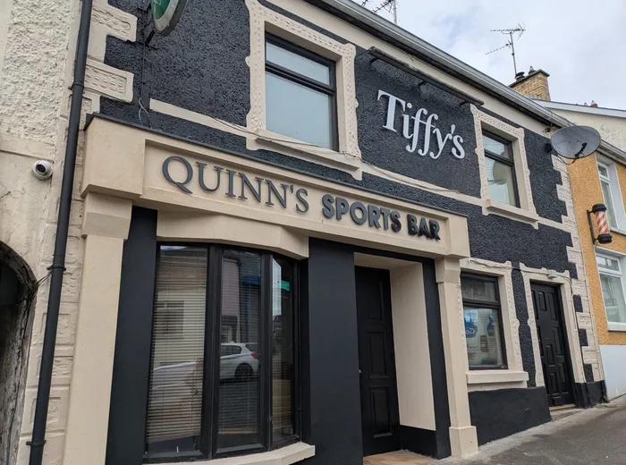 Quinn's Sports Bar building with raised dimensional fascia lettering above the entrance.