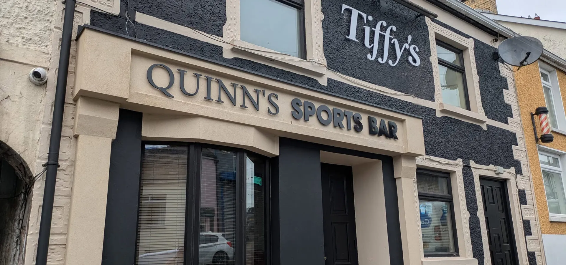Quinn's Sports Bar building with raised dimensional fascia lettering above the entrance.