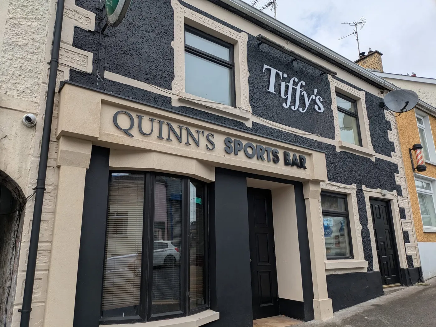 Quinn's Sports Bar building with raised dimensional fascia lettering above the entrance.
