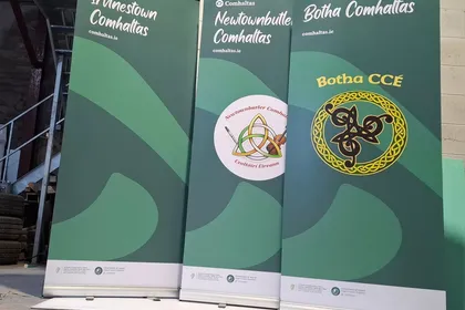 Three roll-up banners for Comhaltas branches (Irvinestown, Newtownbutler and Botha) finished in green branded artwork.